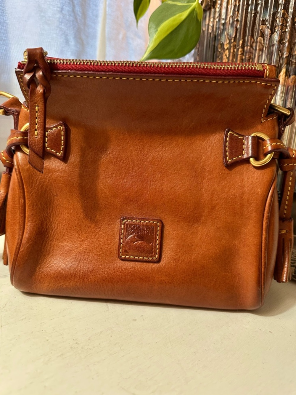 Dooney & Bourke Florentine Cognac Leather Crossbody with Red Zip Accent